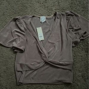 Shimmery purple/gray blouse from Francesca’s. New with tags. Size small